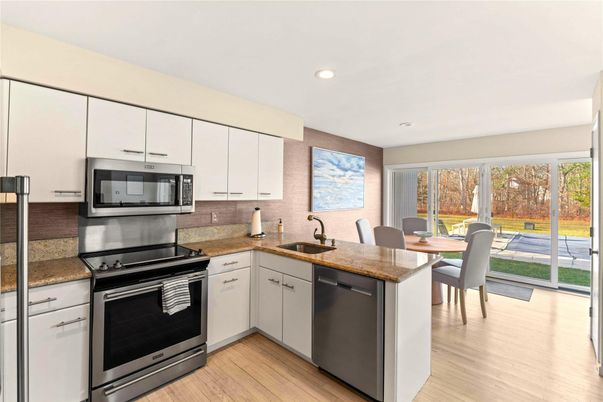 Dining room, Interior, Kitchen, Recessed Lighting, Stainless Steel Appliances, Wood Texture Flooring