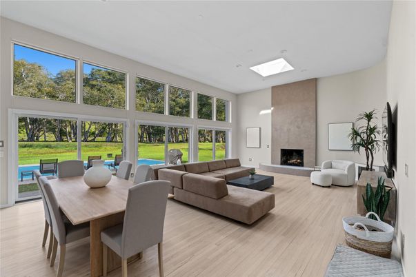 Dining room, Fireplace, Interior, Living room, Recessed Lighting, Wood Texture Flooring