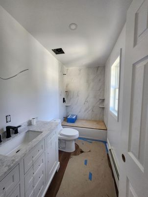 Bathroom, Dual Sink Vanities, Interior, Marble Walls, Recessed Lighting, Wood Texture Flooring