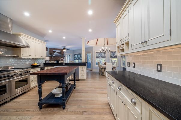 Chandelier, Dining room, Interior, Kitchen, Recessed Lighting, Stainless Steel Appliances, Wood Texture Flooring