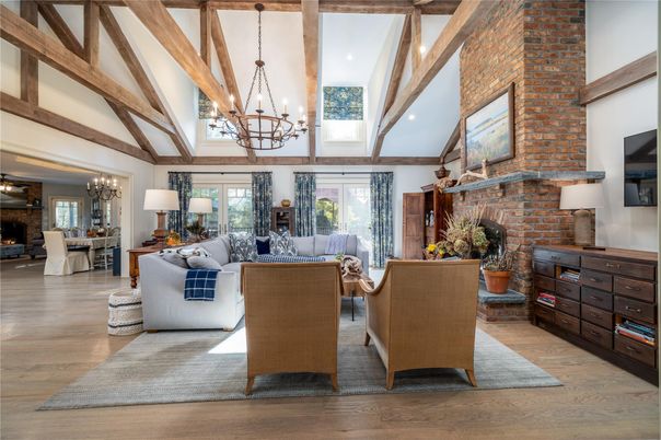 Chandelier, Dining room, Fireplace, Interior, Living room, Recessed Lighting, Stone Walls, Wooden Beams, Wood Texture Flooring