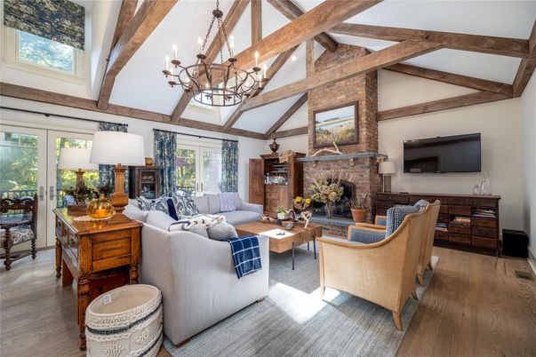 Chandelier, Fireplace, Interior, Living room, Stone Walls, Wooden Beams, Wood Texture Flooring