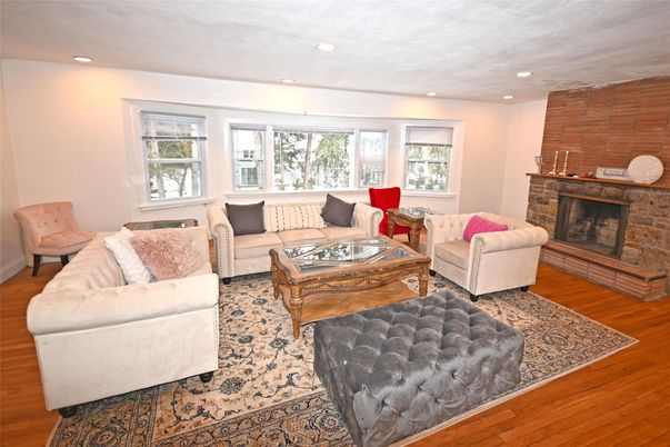 Fireplace, Interior, Living room, Recessed Lighting, Stone Walls, Wood Texture Flooring