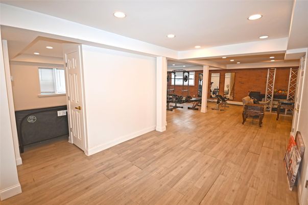 Fitness Equipment, Interior, Recessed Lighting, Stone Walls, Wine Storage, Wood Texture Flooring
