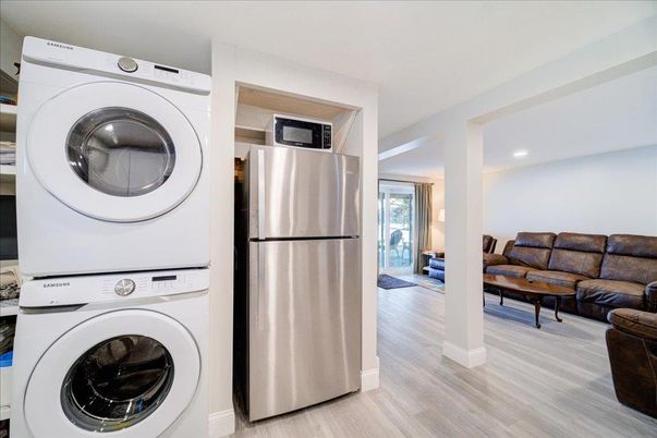 Interior, Kitchen, Living room, Recessed Lighting, Utility Closets, Washer, Wood Texture Flooring