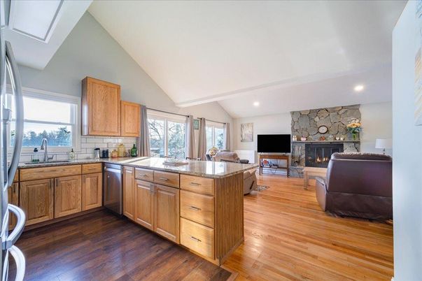 Fireplace, Interior, Kitchen, Living room, Recessed Lighting, Stone Walls, Wood Texture Flooring