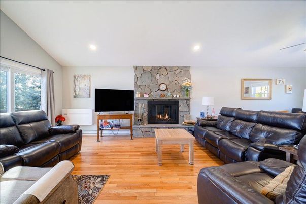 Fireplace, Interior, Living room, Recessed Lighting, Stone Walls, Wood Texture Flooring