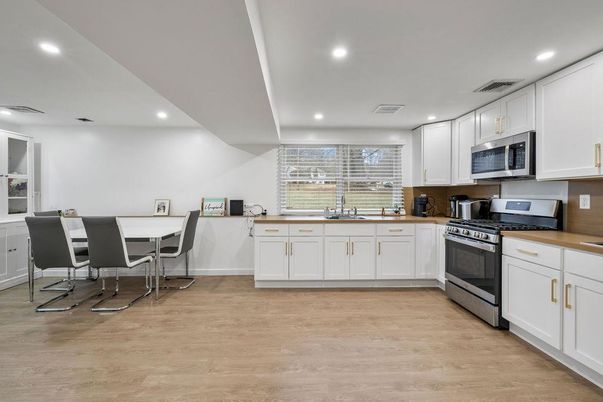 Dining room, Interior, Kitchen, Recessed Lighting, Stainless Steel Appliances, Wood Texture Flooring