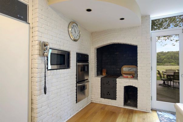 Fireplace, Interior, Kitchen, Recessed Lighting, Stainless Steel Appliances, Stone Walls, Wood Texture Flooring