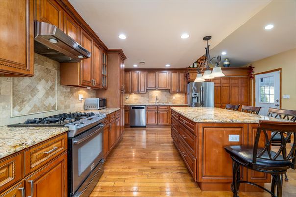 Chandelier, Interior, Kitchen, Pendant Lights, Recessed Lighting, Stainless Steel Appliances, Wood Texture Flooring