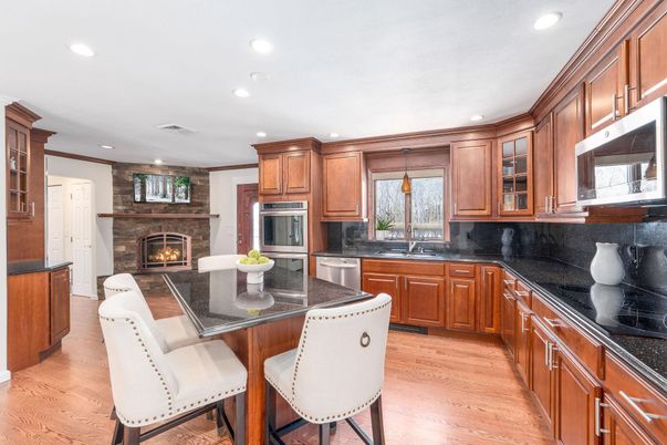 Fireplace, Interior, Kitchen, Recessed Lighting, Stainless Steel Appliances, Wood Texture Flooring