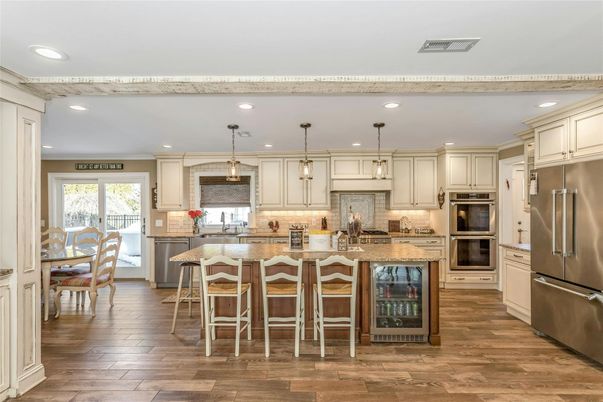 Dining room, Interior, Kitchen, Pendant Lights, Recessed Lighting, Stainless Steel Appliances, Wood Texture Flooring