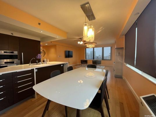 Dining room, Interior, Kitchen, Pendant Lights, Recessed Lighting, Stainless Steel Appliances, Wood Texture Flooring