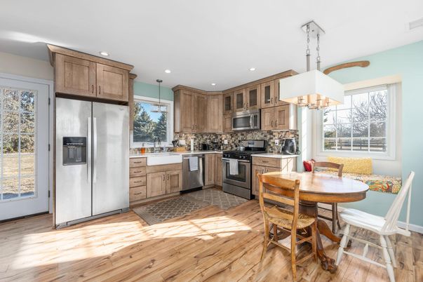 Chandelier, Dining room, Interior, Kitchen, Recessed Lighting, Stainless Steel Appliances, Wood Texture Flooring