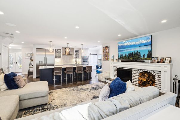 Fireplace, Interior, Kitchen, Living room, Pendant Lights, Recessed Lighting, Stainless Steel Appliances, Wood Texture Flooring