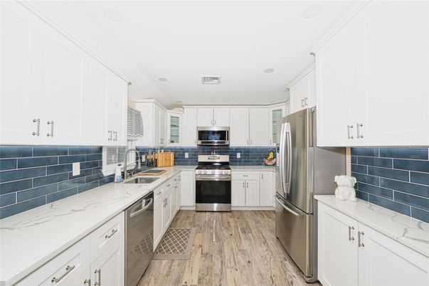 Interior, Kitchen, Recessed Lighting, Stainless Steel Appliances, Wood Texture Flooring