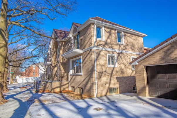 Attached, Exterior, Facade, Brick Facade, American Foursquare