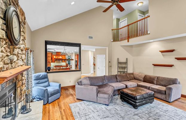 Fireplace, Interior, Living room, Recessed Lighting, Stone Walls, Wood Texture Flooring