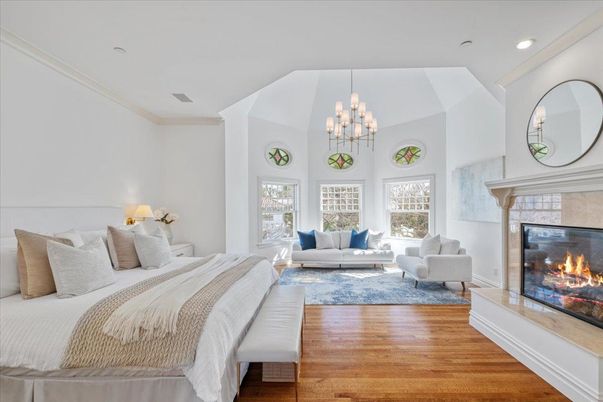 Bedroom, Chandelier, Fireplace, Interior, Recessed Lighting, Wood Texture Flooring