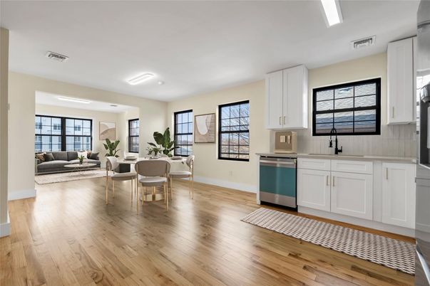 Dining room, Interior, Kitchen, Living room, Recessed Lighting, Stainless Steel Appliances, Wood Texture Flooring