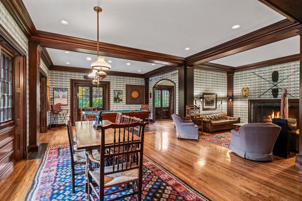 Billiard Table, Dining room, Fireplace, Game Room, Interior, Living room, Pendant Lights, Recessed Lighting, Stone Walls, Wood Texture Flooring