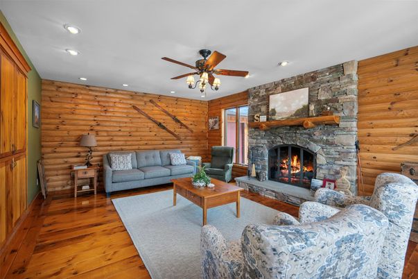 Fireplace, Interior, Living room, Recessed Lighting, Stone Walls, Wood Texture Flooring, Wooden Walls