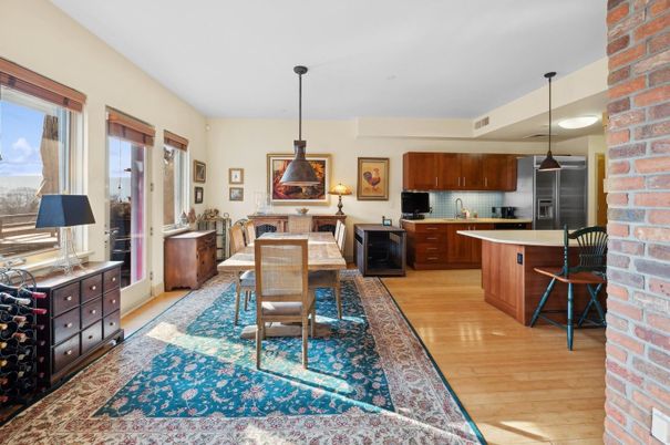 Dining room, Interior, Kitchen, Pendant Lights, Stainless Steel Appliances, Stone Walls, Wood Texture Flooring