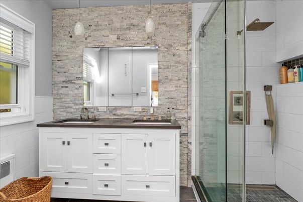 Bathroom, Dual Sink Vanities, Glass Shower, Interior, Pendant Lights, Stone Walls