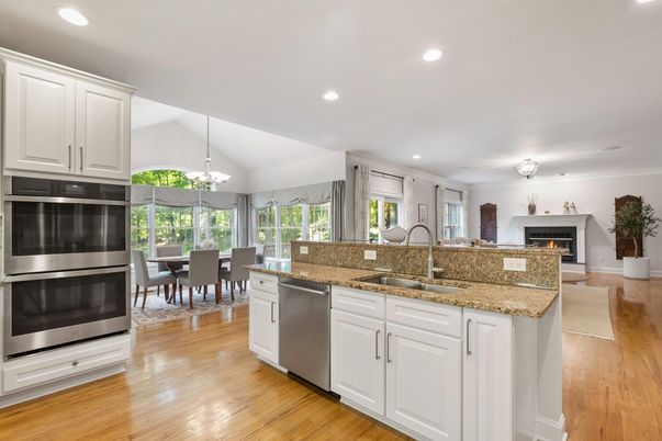 Chandelier, Dining room, Fireplace, Interior, Kitchen, Pendant Lights, Recessed Lighting, Stainless Steel Appliances, Wood Texture Flooring