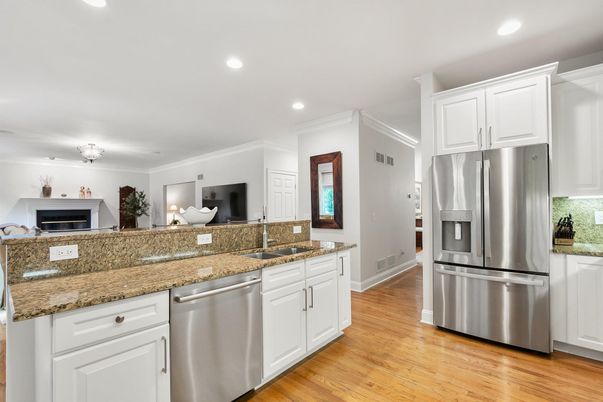 Fireplace, Interior, Kitchen, Recessed Lighting, Stainless Steel Appliances, Wood Texture Flooring