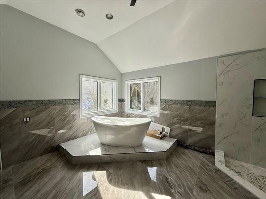 Bathroom, Free Standing Baths, Glass Shower, Interior, Marble Walls, Recessed Lighting, Wood Texture Flooring