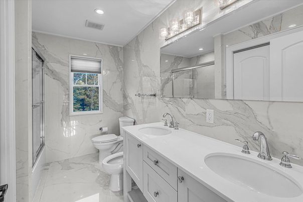 Bathroom, Dual Sink Vanities, Glass Shower, Interior, Marble, Marble Walls, Recessed Lighting