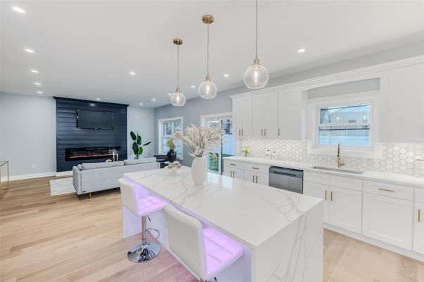 Fireplace, Interior, Kitchen, Living room, Pendant Lights, Recessed Lighting, Stainless Steel Appliances, Wood Texture Flooring