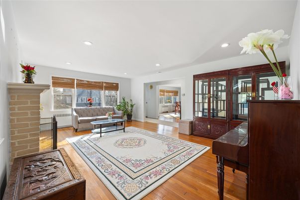 Fireplace, Interior, Living room, Piano, Recessed Lighting, Wood Texture Flooring