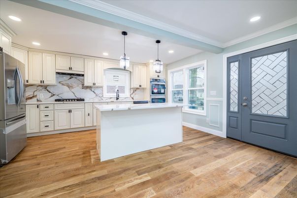Interior, Kitchen, Marble Walls, Pendant Lights, Recessed Lighting, Stainless Steel Appliances, Wood Texture Flooring