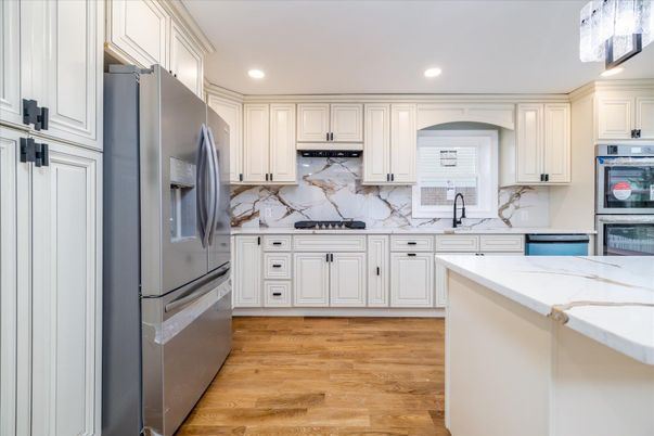 Interior, Kitchen, Marble Walls, Recessed Lighting, Stainless Steel Appliances, Wood Texture Flooring