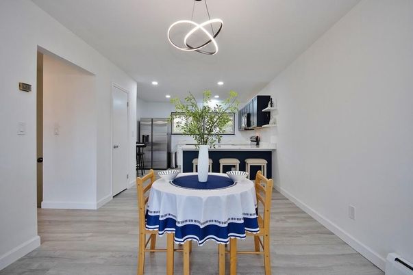 Dining room, Interior, Kitchen, Pendant Lights, Recessed Lighting, Stainless Steel Appliances, Wood Texture Flooring