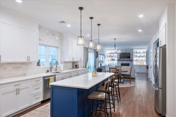 Dining room, Interior, Kitchen, Pendant Lights, Recessed Lighting, Stainless Steel Appliances, Wood Texture Flooring