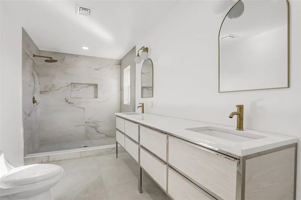 Bathroom, Dual Sink Vanities, Glass Shower, Interior, Marble Walls, Recessed Lighting