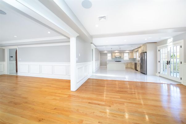 Empty room, Interior, Kitchen, Pendant Lights, Recessed Lighting, Stainless Steel Appliances, Wood Texture Flooring