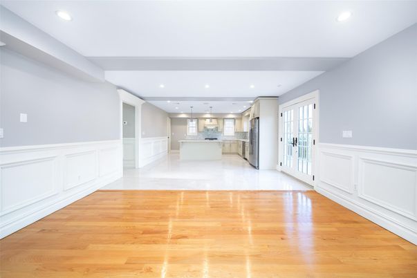 Empty room, Interior, Kitchen, Pendant Lights, Recessed Lighting, Stainless Steel Appliances, Wood Texture Flooring