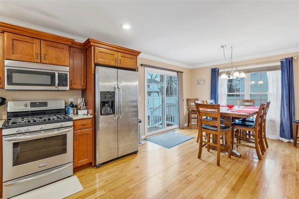 Dining room, Interior, Kitchen, Pendant Lights, Recessed Lighting, Stainless Steel Appliances, Wood Texture Flooring