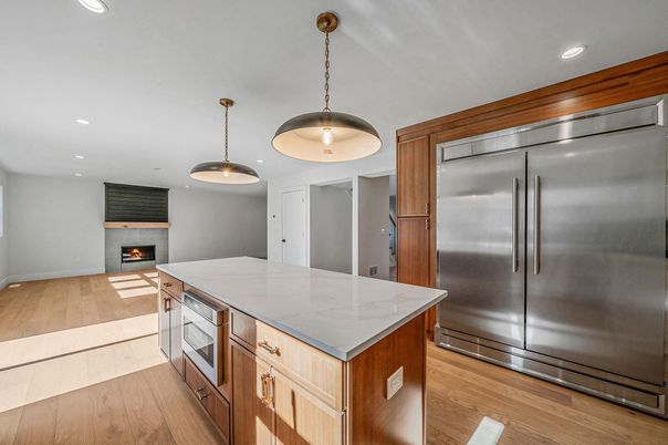 Fireplace, Interior, Kitchen, Pendant Lights, Recessed Lighting, Stainless Steel Appliances, Wood Texture Flooring