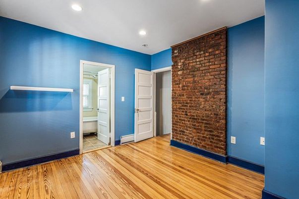 Empty room, Interior, Recessed Lighting, Stone Walls, Wood Texture Flooring