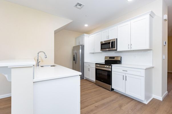 Interior, Kitchen, Recessed Lighting, Stainless Steel Appliances, Wood Texture Flooring