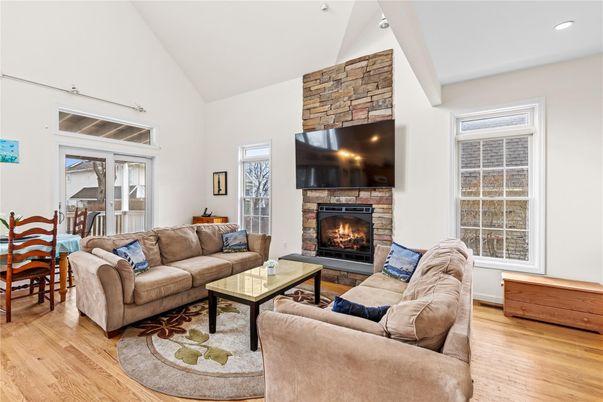 Fireplace, Interior, Living room, Recessed Lighting, Stone Walls, Wood Texture Flooring