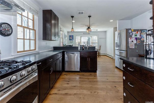 Dining room, Interior, Kitchen, Pendant Lights, Recessed Lighting, Stainless Steel Appliances, Wood Texture Flooring