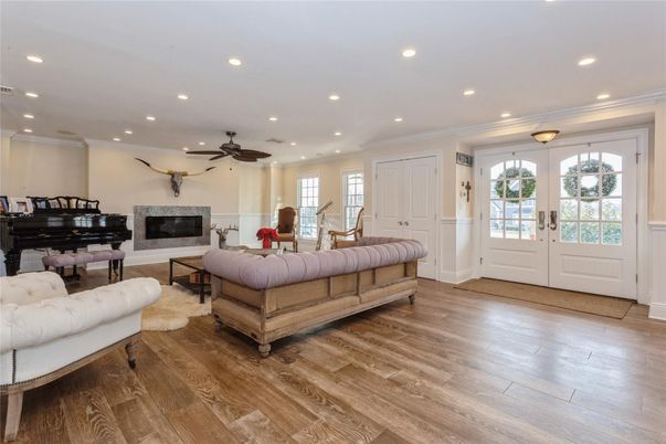 Fireplace, Interior, Living room, Piano, Recessed Lighting, Wood Texture Flooring