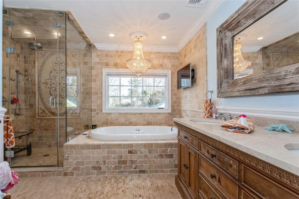 Bathroom, Chandelier, Glass Shower, Interior, Recessed Lighting, Stone Walls