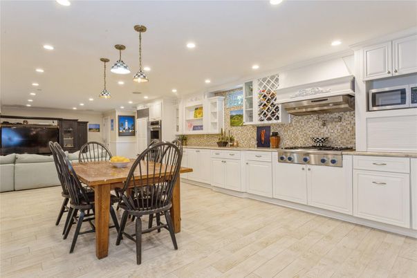 Dining room, Interior, Kitchen, Pendant Lights, Recessed Lighting, Stainless Steel Appliances, Wood Texture Flooring